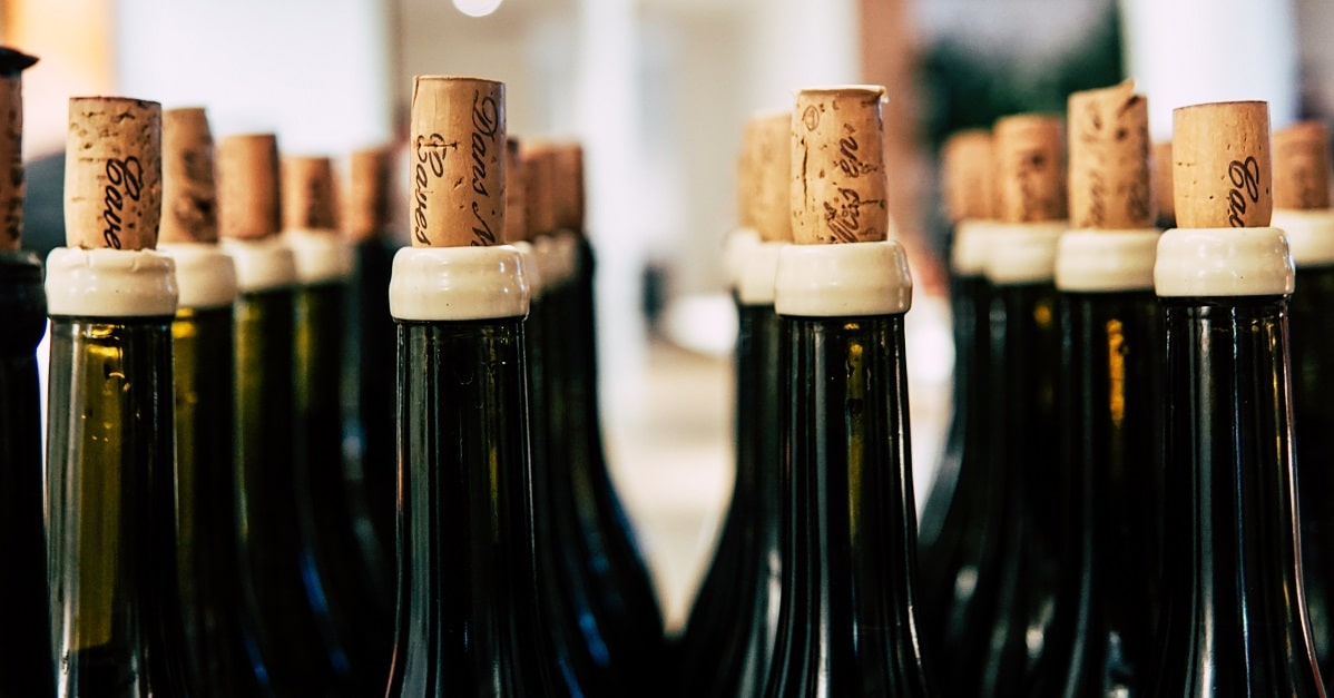 Rows of corked wine bottles